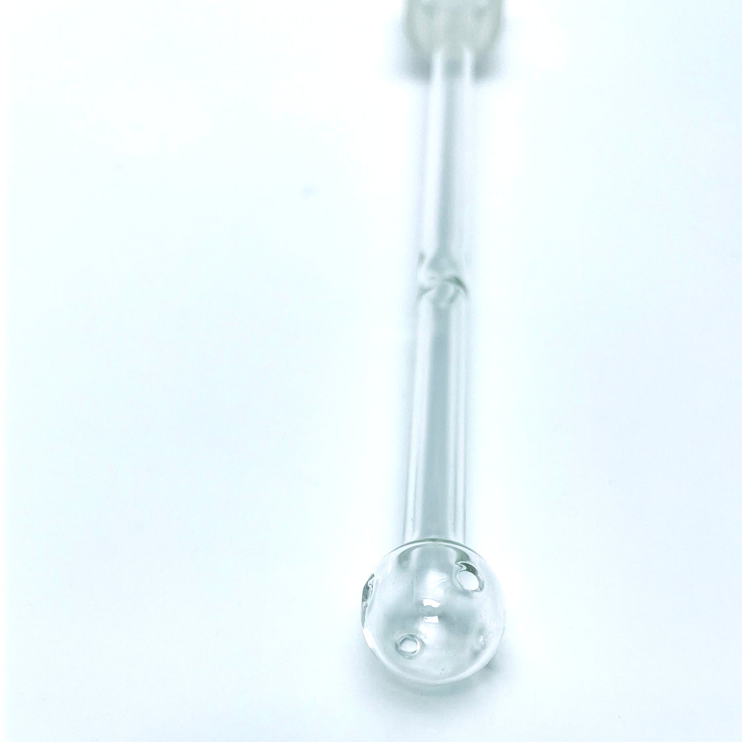 Close up on Oil Bubbler stem end on a white background.
