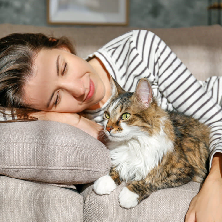 Woman bonding with cat for ozone therapy