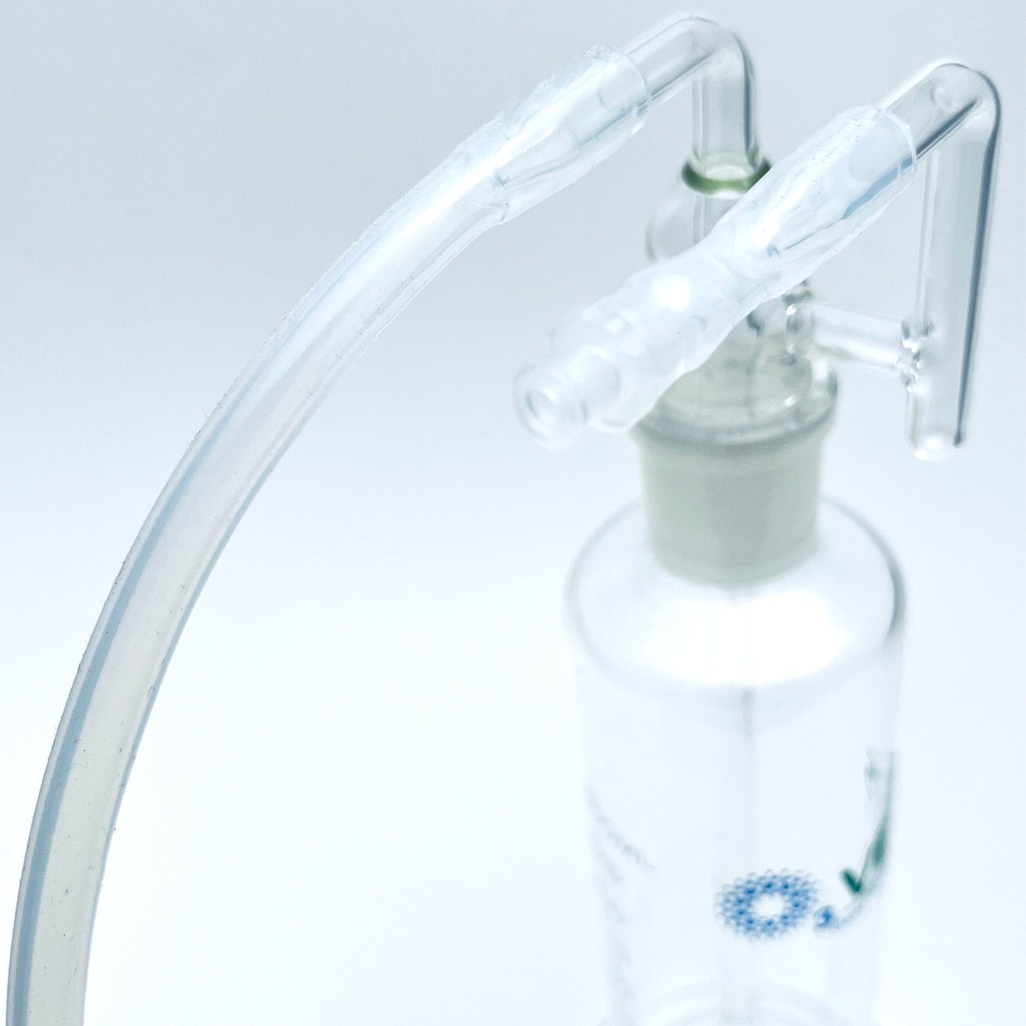 Close up on fluid bubbler top with tubing.