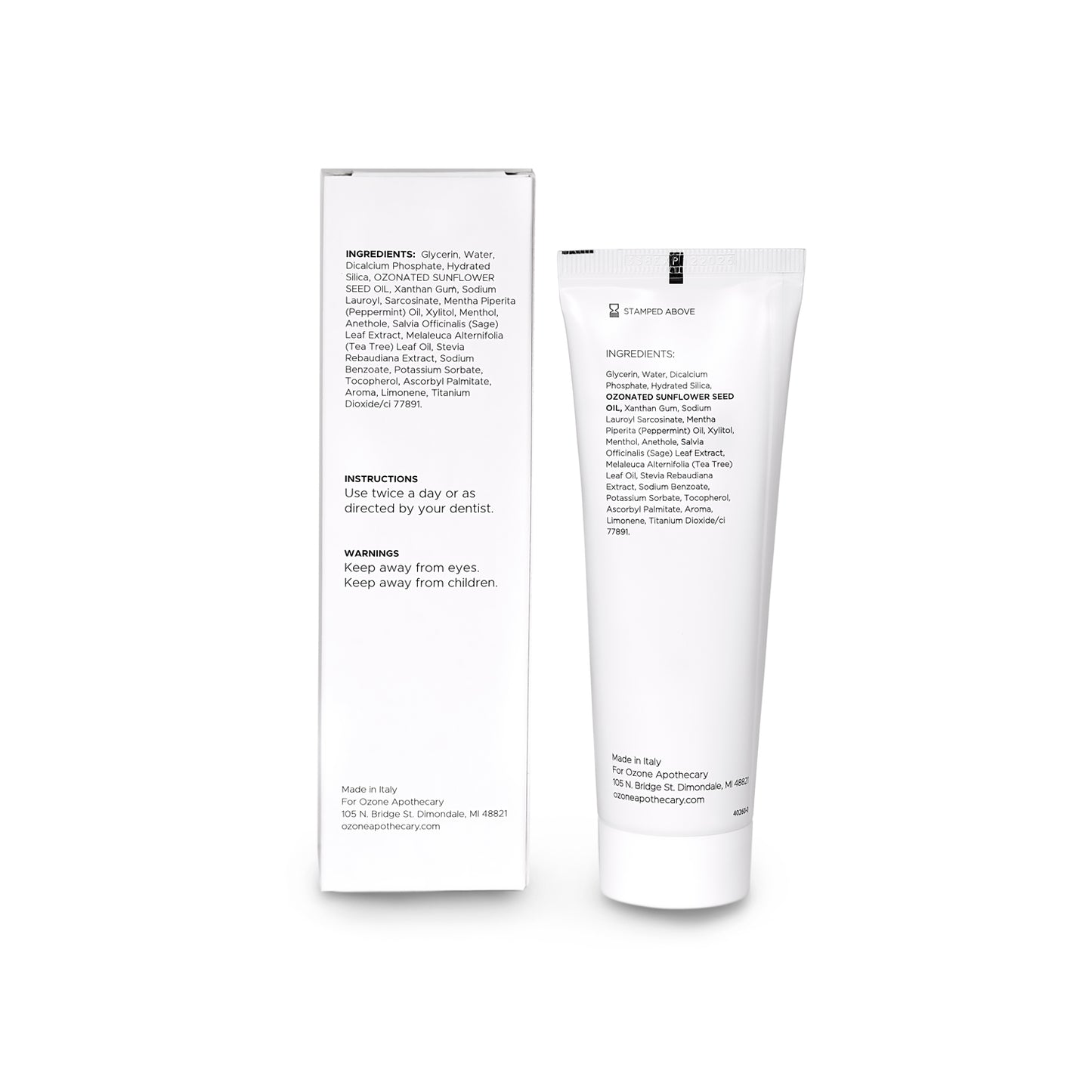 White OA toothpaste tube and packaging with text on a white background