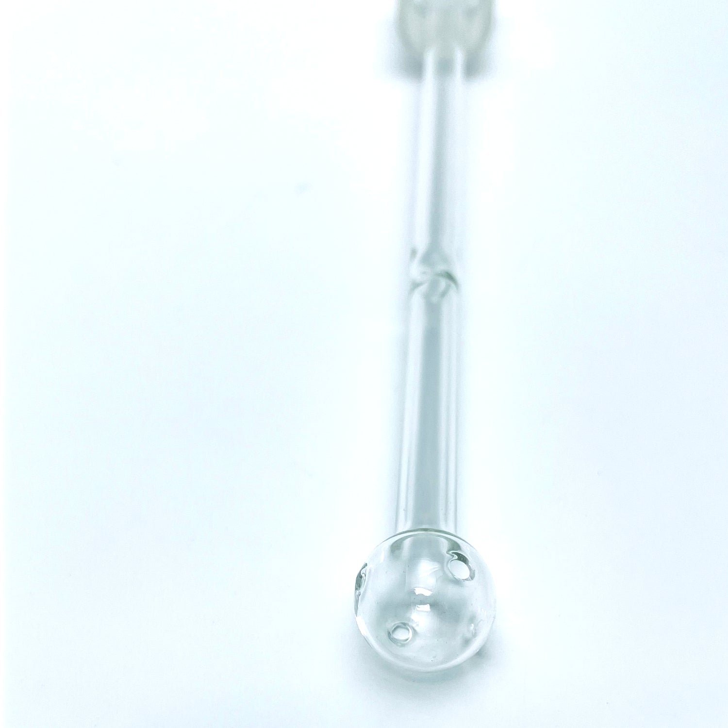 Close up on Oil Bubbler stem end on a white background.