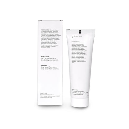 White OA toothpaste tube and packaging with text on a white background