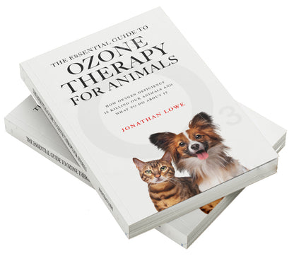 The Essential Guide to Ozone Therapy for Animals books in a stack of two on a white background.